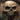 A giant stone skull in an escape room.